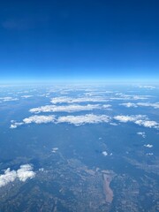 view from plane over europe blue sky