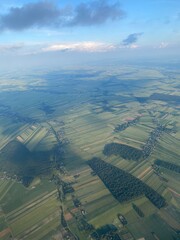 view from plane over europe blue sky