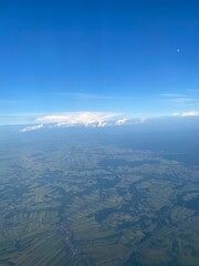 view from plane over europe blue sky