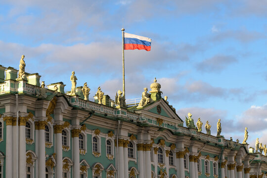 Winter Palace and Russian flag in Saint Petersburg, Russia
