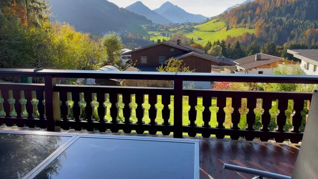 Great views of Alps mountains from cottage terrace at sunrise in Austria. Natural landscape, tourism destination, rural getaway concepts