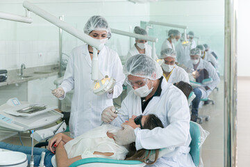 dentistry student in a practical class - obrazy, fototapety, plakaty
