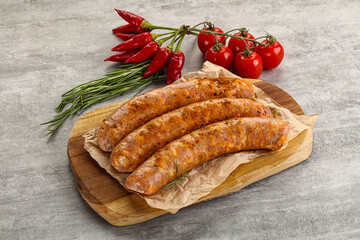 Raw sausages with spices and herbs