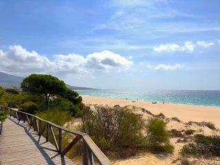 Photo sur Plexiglas Plage de Bolonia, Tarifa, Espagne view from a wooden walkway to the beautiful beach and dunes at the Playa de Bolonia at the Costa de la Luz, Andalusia, Cadiz, Spain