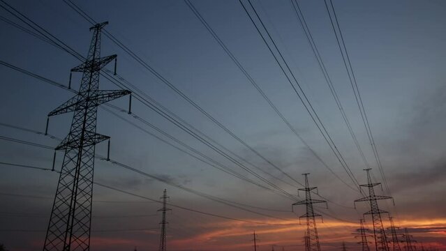Large power poles and beautiful sunset