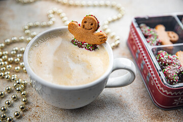 gingerbread and a cup of hot coffee christmas cookie taste christmas sweet dessert holiday baking treat new year and christmas celebration meal food snack on the table - Powered by Adobe
