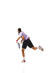 Fototapeta premium Competitive athletic man, tennis player during game in motion with racket, playing isolated over white background. Concept of professional sport, movement, competition, action. Ad