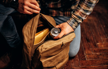 Man hold Canvas Backpack accessories. Hand made backpack for travelers.