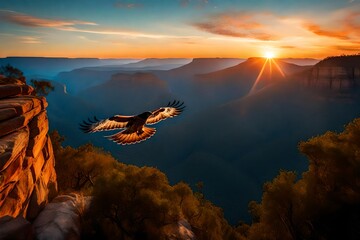 Flying over the blue mountains and sunset sky is a red-tailed hawk