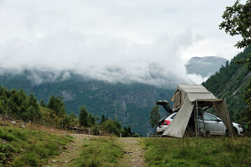 Car with a rooftop tent in the mountains in norway