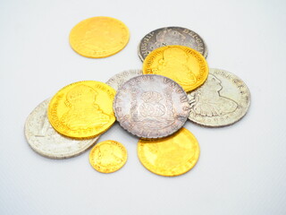 Coins of the kings of Spain in gold, silver, and bronze: Escudo, Dollar, Spanish Real, Jeton
