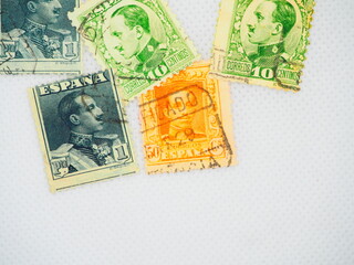 Spanish stamps from Alfonso XIII on a white background and in an album