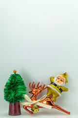 Santa Claus and reindeer with christmas tree on white background with copy space
