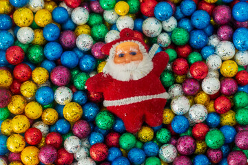 Fototapeta na wymiar Santa Claus and colorful Christmas ball background, Merry Christmas background.