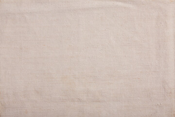 Close-up of organic handmade linen fabric in a natural eggshell hue, showcasing a soft and textured surface
