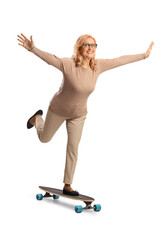 Mature woman riding a skateboard and spreading arms © Ljupco Smokovski