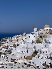 Beautiful Oia town on Santorini island, Greece. Traditional white architecture and greek orthodox...