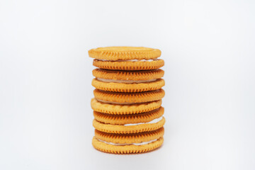 milk round cookies on a white background. shortbread cookies for tea drinking. a subject photo shoot of sweet cookies in a photo studio