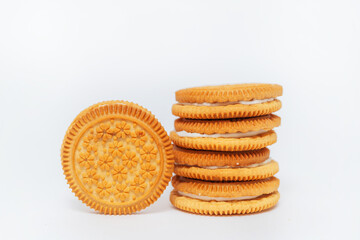milk round cookies on a white background. shortbread cookies for tea drinking. a subject photo shoot of sweet cookies in a photo studio