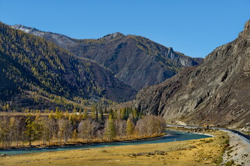 Russia. The South of Western Siberia, Altai Mountains. Only in the middle of autumn, when the mountain glaciers stop melting, the water in the Katun River becomes transparent and rich turquoise color.