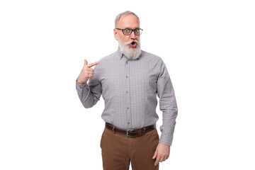 a gray-haired mature man with a beard and mustache in trousers and a shirt is emotionally annoyed