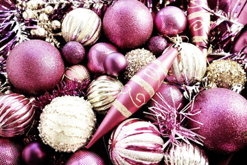 New Year's Christmas balls, tinsel and decorations close up. Decorations of golden, pink, lilac,...