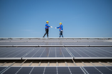 Both of technician working on a photovoltaic solar panels