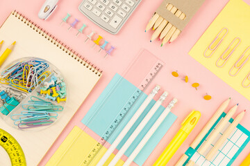 stationery items for girls or women on light pink background. Back to school. Female Student's, pupil's or engineer's supplies. Office objects on pastel pink background. Calculator, pen, pencil etc. - 698189182
