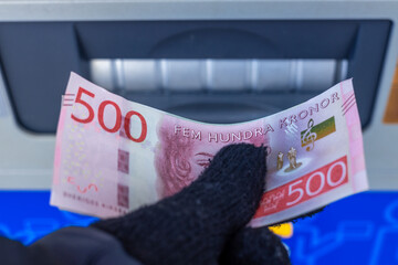 Sweden money, 500 Swedish krona banknote withdrawn from an ATM or inserted into a cash deposit...