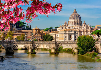 St Peter's basilica in Vatican and St. Angel bridge over Tiber river in spring, Rome, Italy