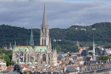 Nancy, France - July 28th 2020 : View of Nancy from the Nancy Cathedral. You can see the Saint-Epvre Basilica, build in Gothic Revival architecture between 1864 and 1874, in front of wooded hill. 