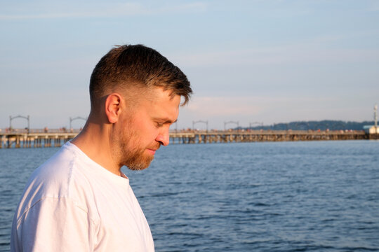 Fototapeta A man portrait with a motor jacket along the sea. High quality photo