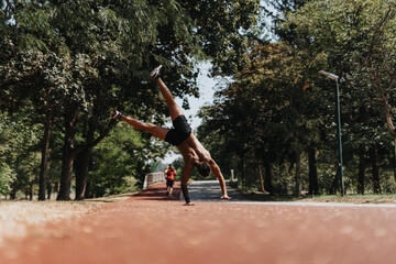 Active Athlete Doing Cartwheels in the Park on a Sunny Day
