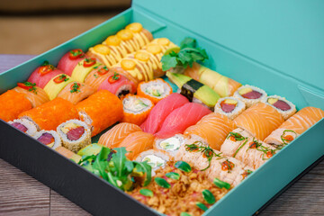 Sushi and rolls in a box, Japanese food delivery