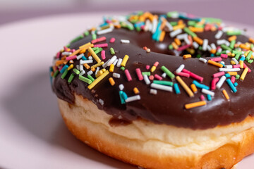 chocolate donut on a black plate