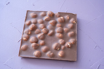 coffee beans and dried orange chocolates on blue background