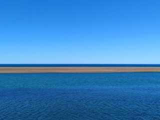 Blue Coastline and Sandbank in Patagonia, Tierra del Fuego, Argentina.