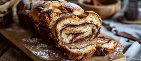 Crédence de cuisine en plexiglas Boulangerie Sliced cinnamon swirl bread on a board.