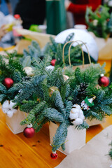 Master class on making a New Year composition from spruce branches and Christmas tree decorations....