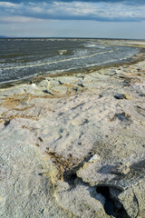 The shore of a hyperhaline lake covered with self-precipitating salt Sodium chloride, California