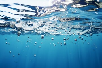 Naklejka na ściany i meble Soothing blue water background with bubbles and glistening water surface