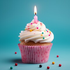 Close-up of birthday cupcake with one candle on blue background with flying confetti and bokeh