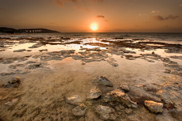 Sunrise at Bahia Honda State Park in the Florida Keys with the historic Bahia Honda bridge on the horizon.