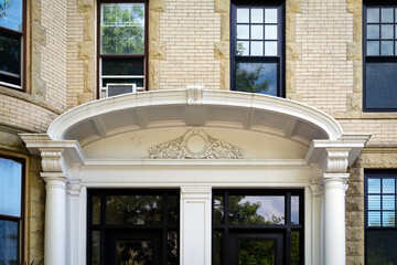 Upper entrance detail and windows of an old residential building in Brookline MA, USA