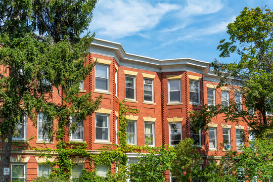 Red brick classic style row houses in a summer day, Brighton, MA, USA