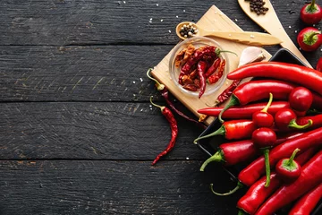  Red hot chili pepper composition, spicy organic paprika background © RomanWhale studio