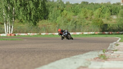 Male person move motorbike. Rider man drive motorcycle. Extreme sports motorcycle driver on the track. Moto trip