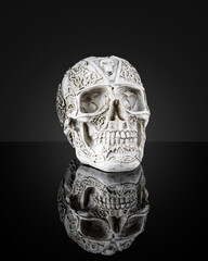 Decoration. Human skull with reflection isolated on black background.