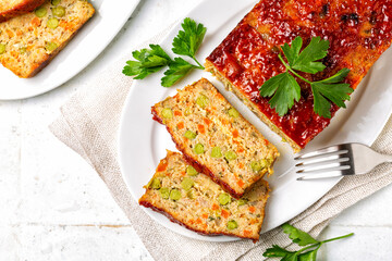 Top view of homemade meatloaf or terrine with mix of chicken and turkey meat, carrot, leek and...
