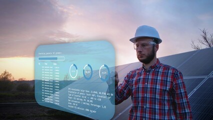Engineer looking at holographic statistic and data of a solar farm - graphics